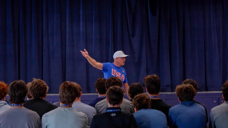 Tyler Travis addressing a group of athletes at a development camp